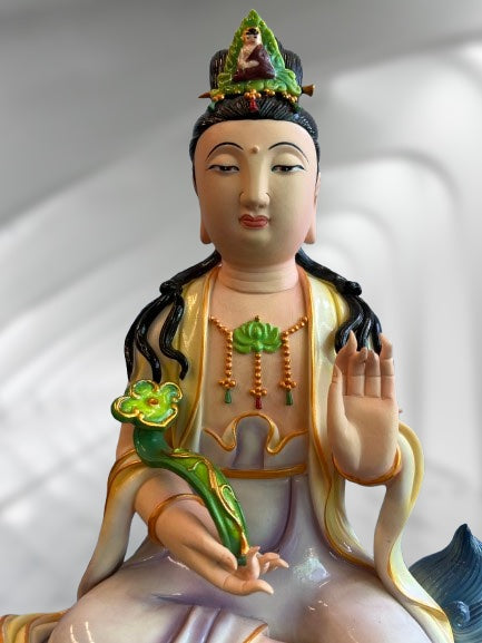 Porcelain Seated Quan Yin on Lion 11"