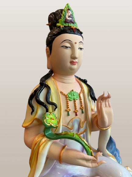 Porcelain Seated Quan Yin on Lion 11"
