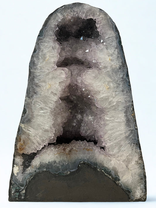 Geode with crystal formation on a white background