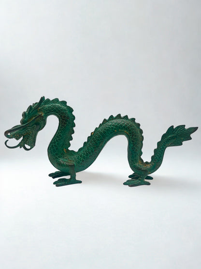 Green dragon sculpture on a white background