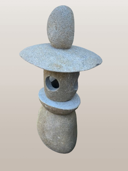 Japanese stone lantern on a beige background