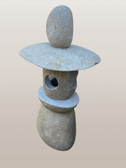 Japanese stone lantern on a beige background