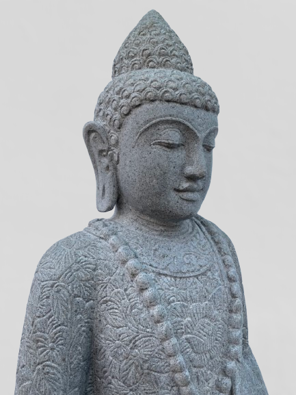 Stone statue of a Buddha figure on a plain background