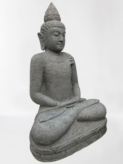 Stone statue of a seated Buddha on a white background
