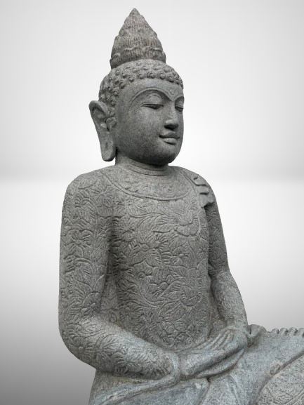 Stone statue of a seated Buddha on a plain background