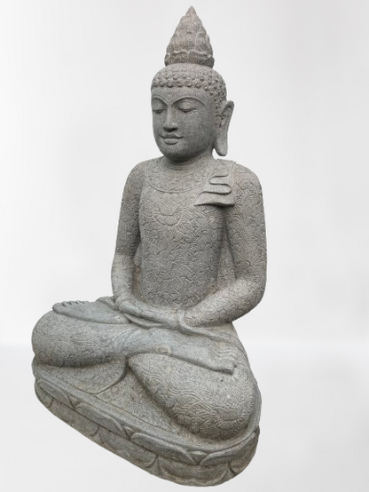 Stone statue of a seated Buddha on a white background