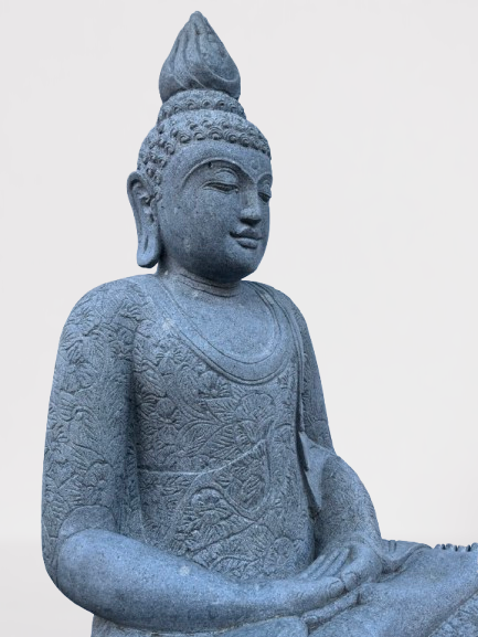 Stone statue of a seated Buddha on a light gray background