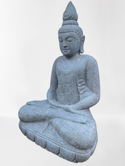Stone statue of a seated Buddha on a light gray background