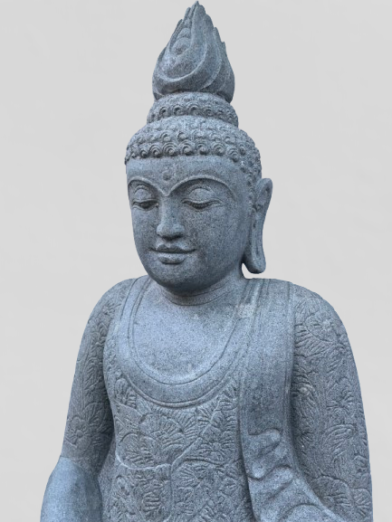 Stone statue of a seated Buddha on a plain background