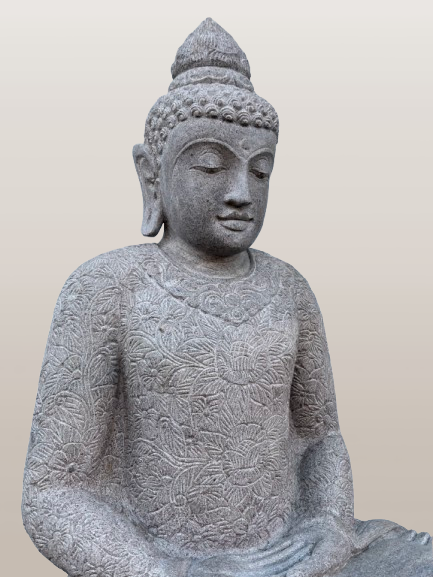Stone statue of a seated Buddha on a plain background