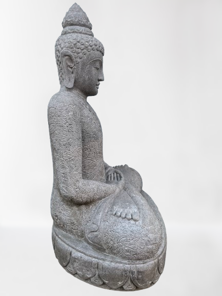 Stone statue of a seated Buddha on a white background