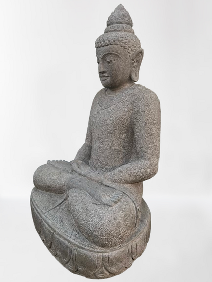 Stone statue of a seated Buddha on a white background