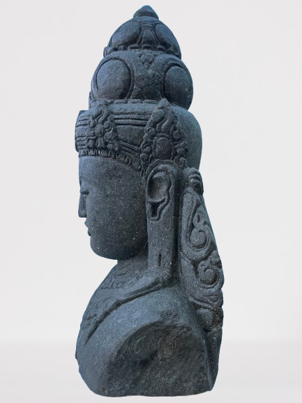 Stone sculpture of a face with intricate carvings on a white background