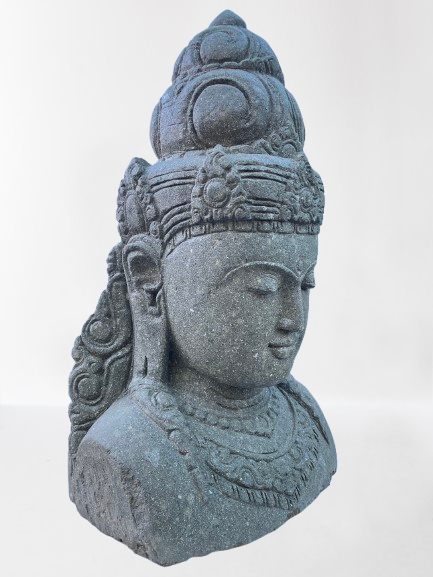 Stone sculpture of a face with intricate details on a white background