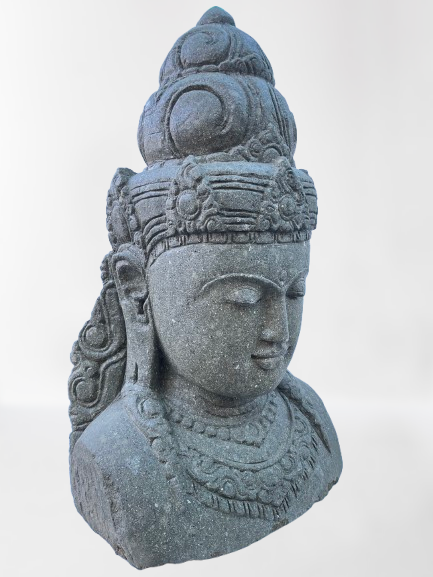 Stone sculpture of a goddess face with intricate details on a white background