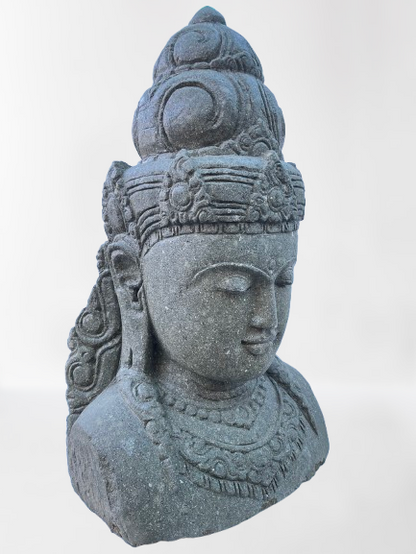 Stone sculpture of a goddess face with intricate details on a white background