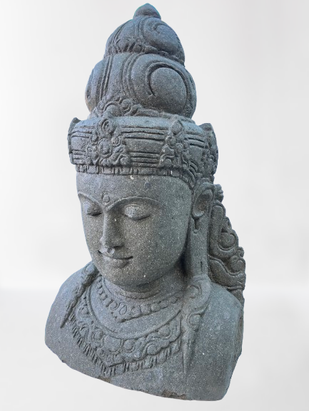 Stone sculpture of a face with intricate details on a white background