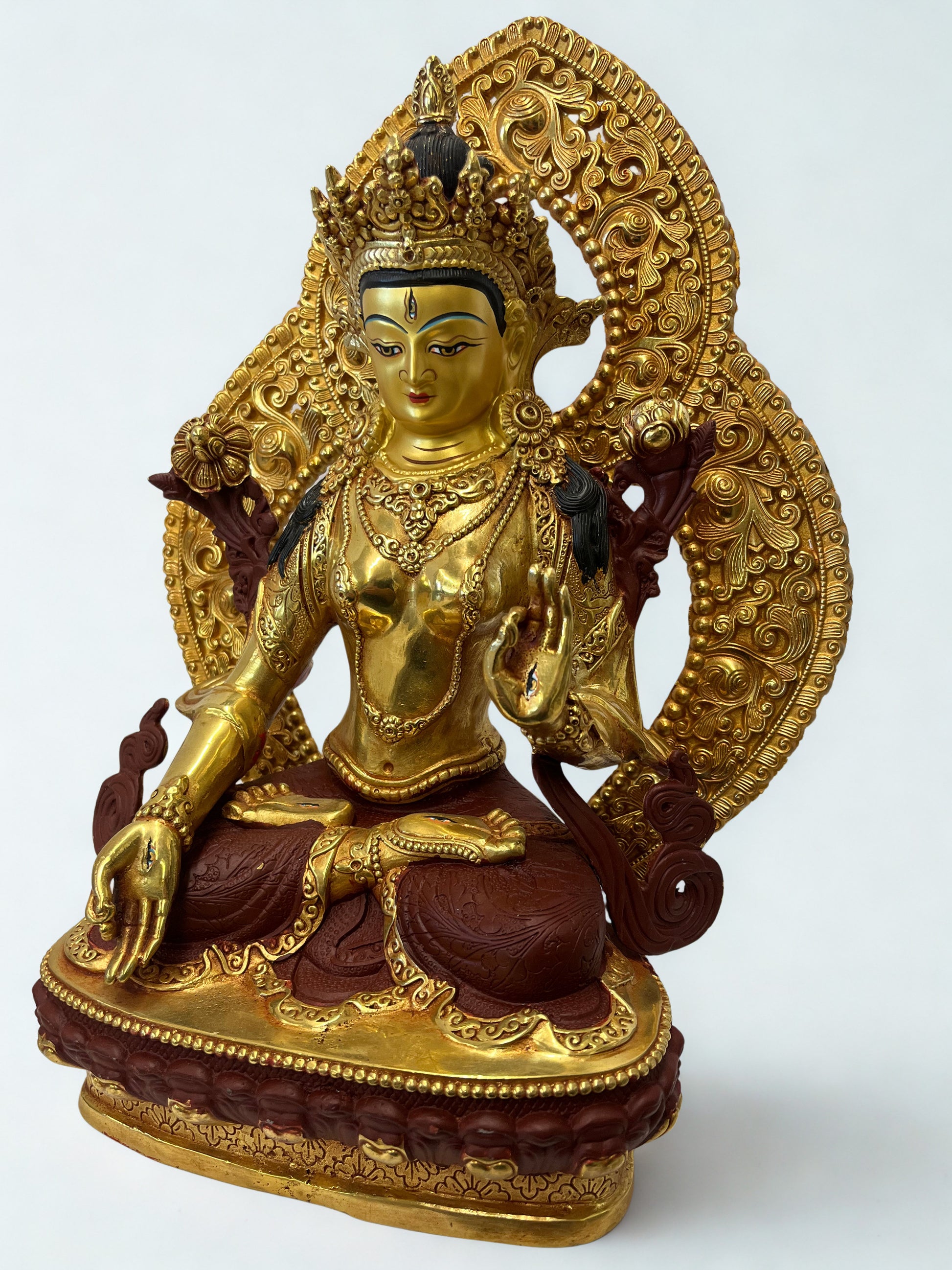 White Tara brass statue 12 inch handcrafted seated in lotus posture with radiant lotus halo, gold tone finish, detailed crown, robes and sacred jewelry, seven eyes symbolism, Buddhist goddess of compassion healing wisdom and long life, spiritual altar decor for meditation yoga and sacred home spaces