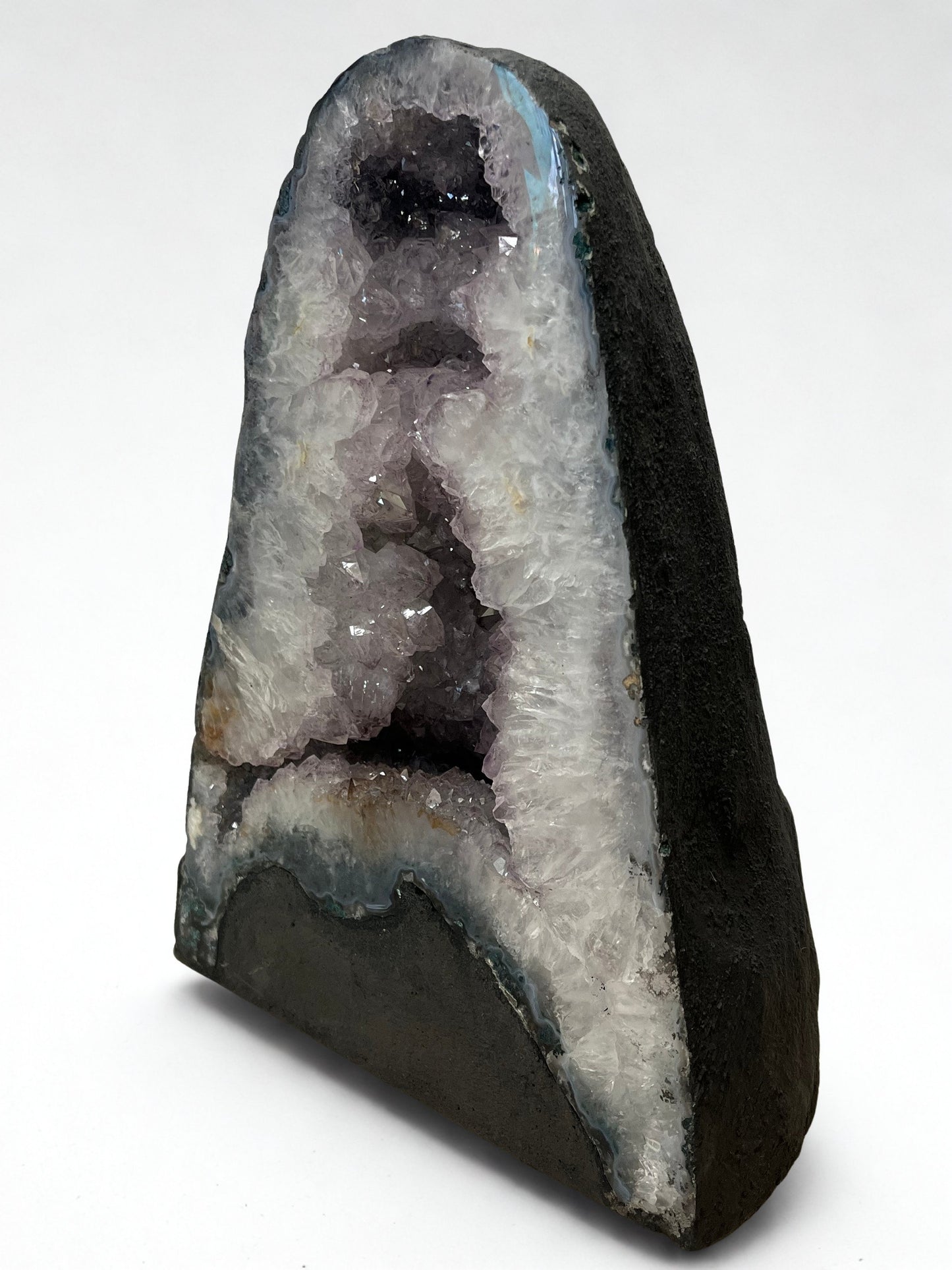Geode with crystal formation on a white background