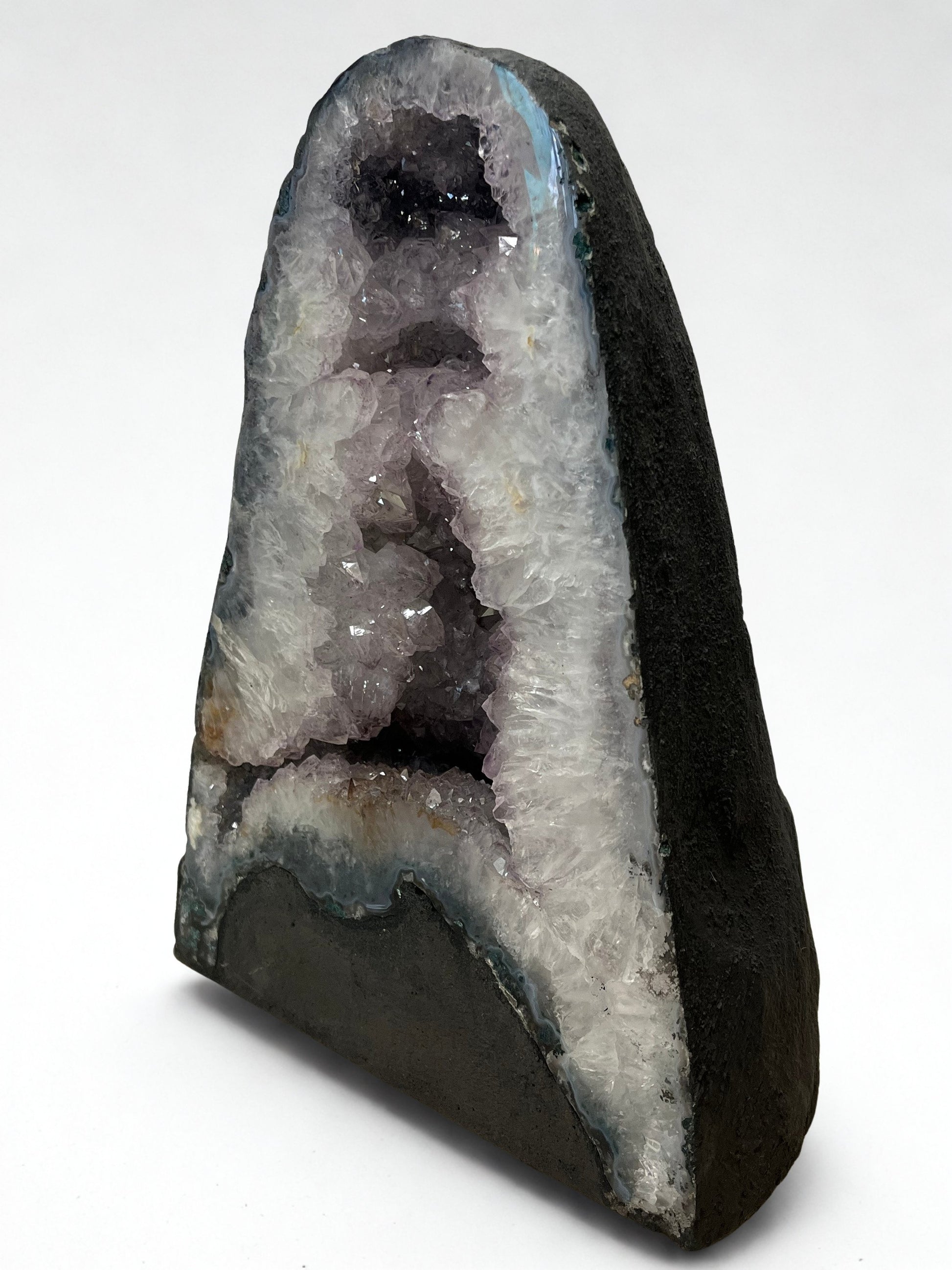 Geode with crystal formation on a white background